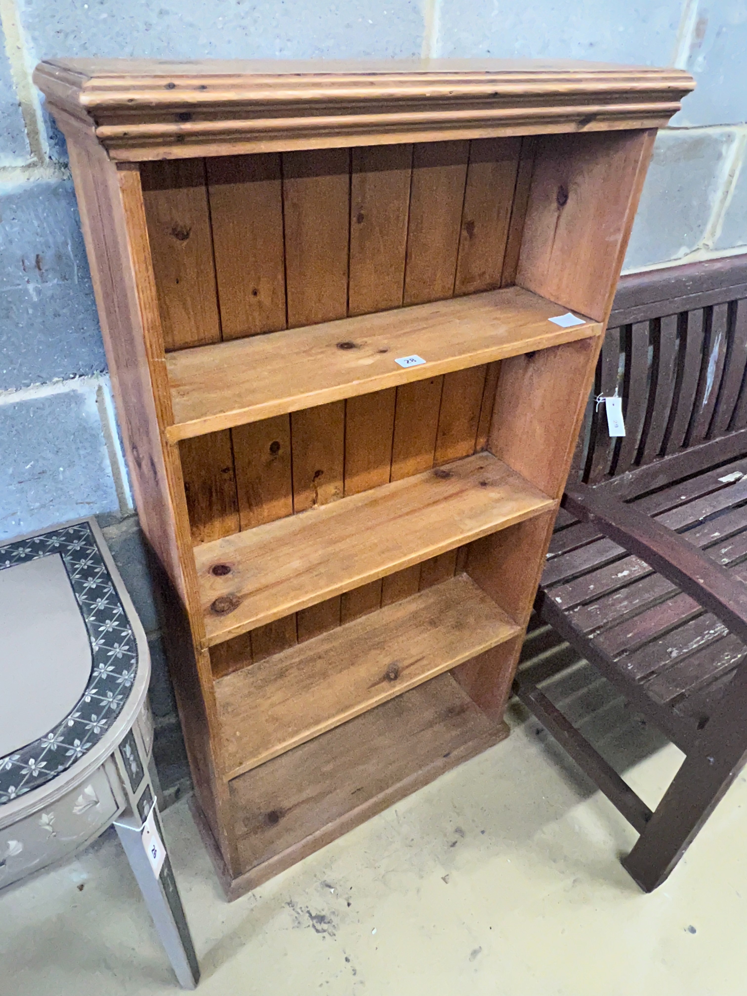 A pine open bookcase, width 66cm depth 21cm height 125cm